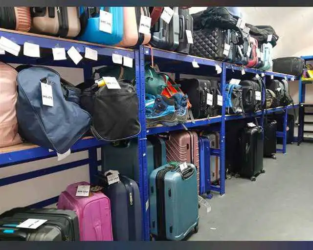 Luggage stored safely on blue shelving